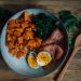 Delicious and nutritious meal featuring salmon, sweet potato, and eggs, perfect for a healthy diet.